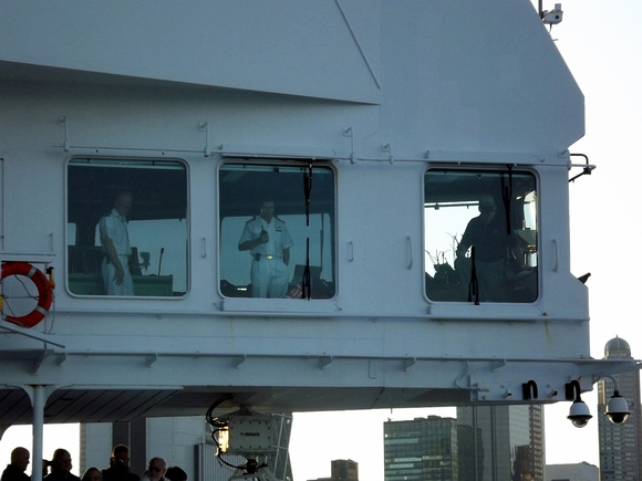 Commodore Christopher Rynd on the bridge of Queen Mary 2 (left hand window)